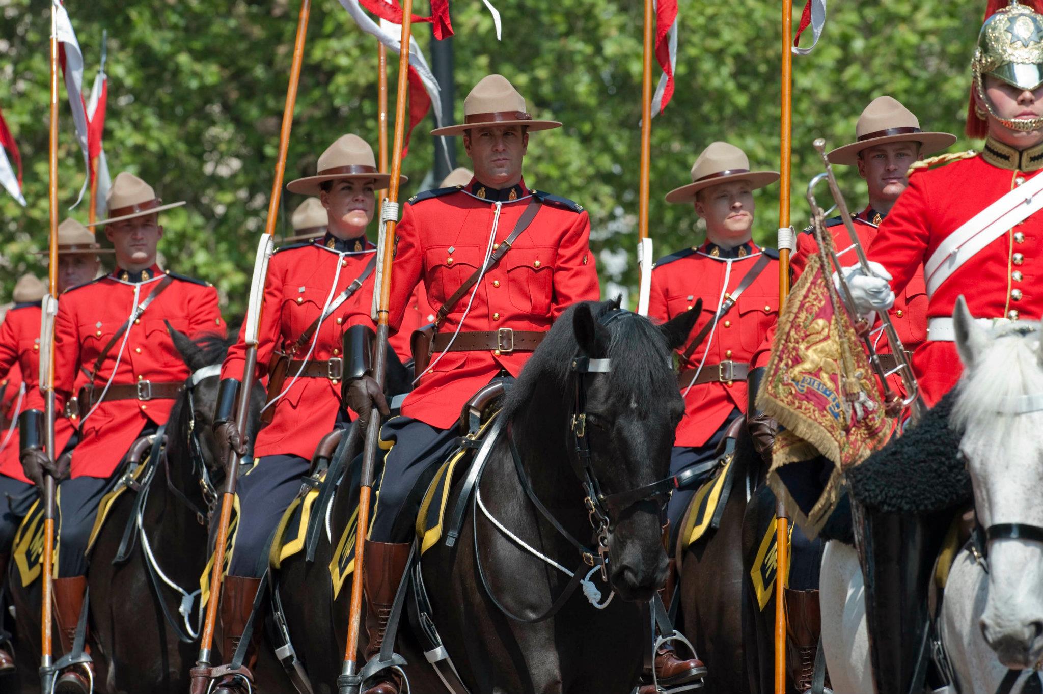 The Royal Canadian Mounted Police riding down The Mall